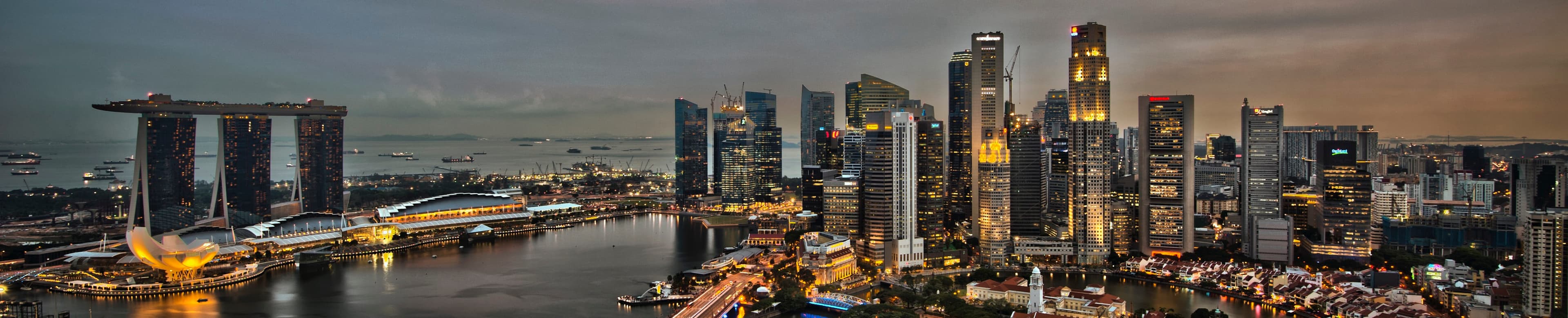 The Marina Bay and Central Business District skyline at dusk, seen across the water